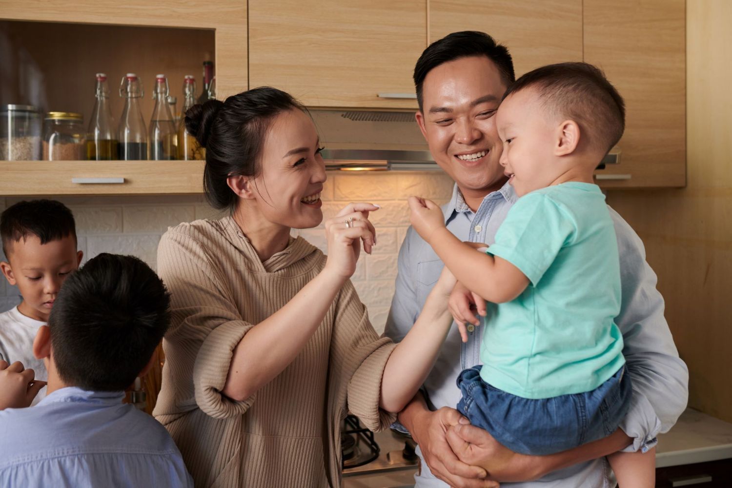 A Vietnamese family in the kitchen.