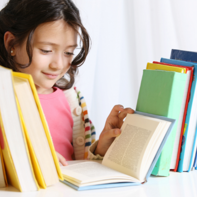 student reading library books