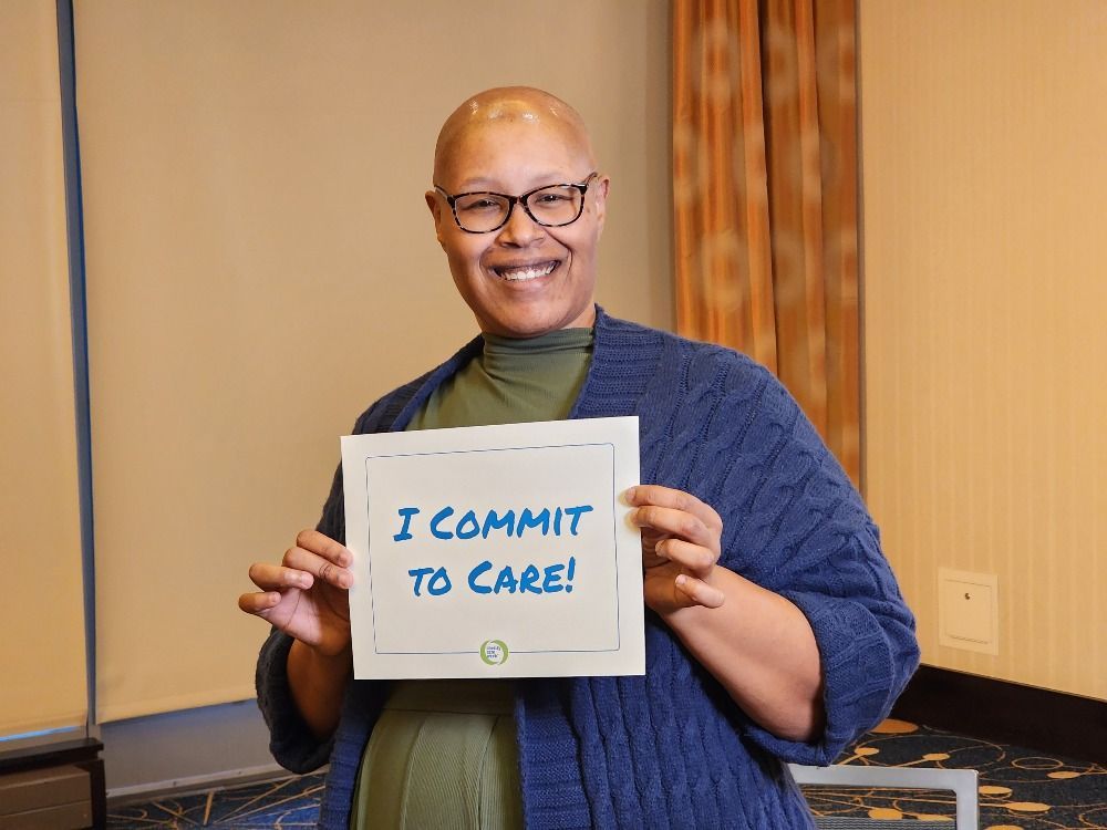 Nikki Massie, OAC Incoming Board Chair, holds the Obesity Care Week 