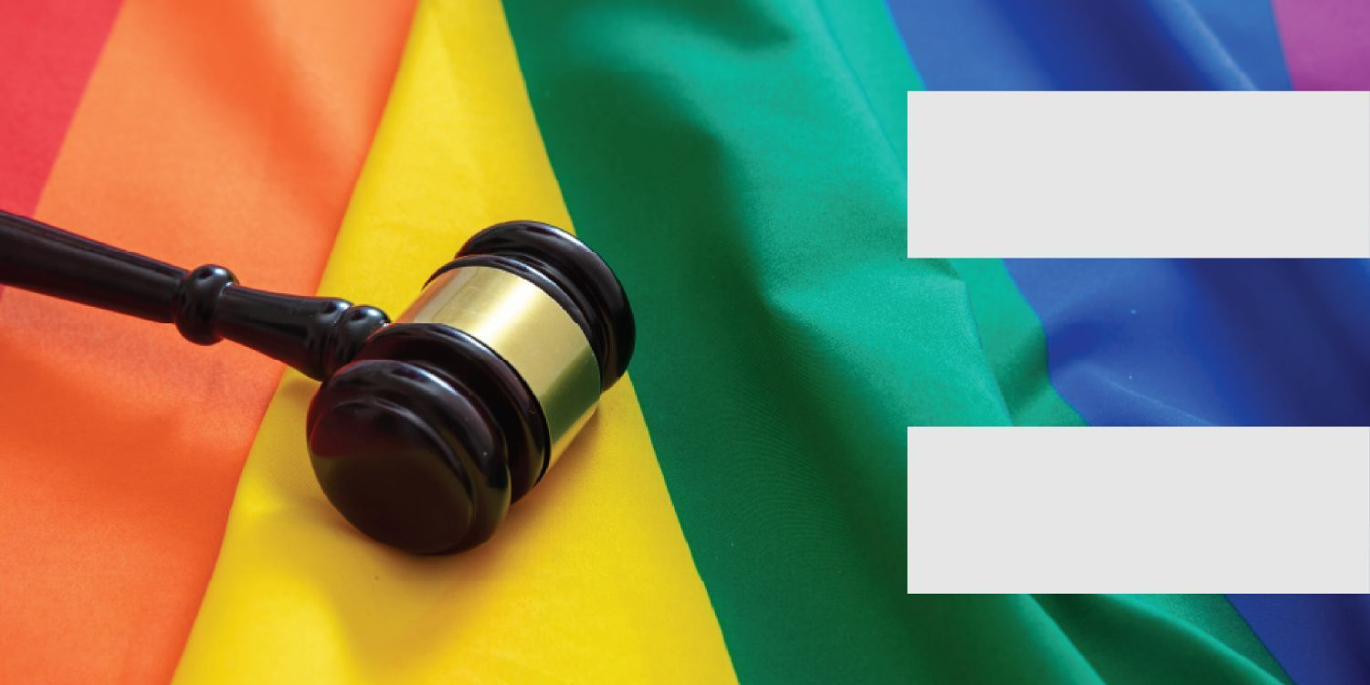 Pride flag with gavel on top of it.