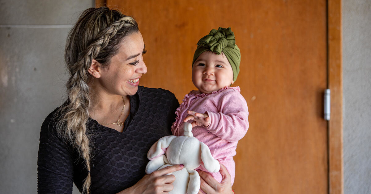 Diana holds her one-year old daughter. A home visiting program has been in Diana's life since her first pregnancy, forging a strong bond built on trust and encouragement.