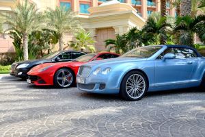 Luxury cars in front of a hotel on Dubai's Palm Jumeirah.