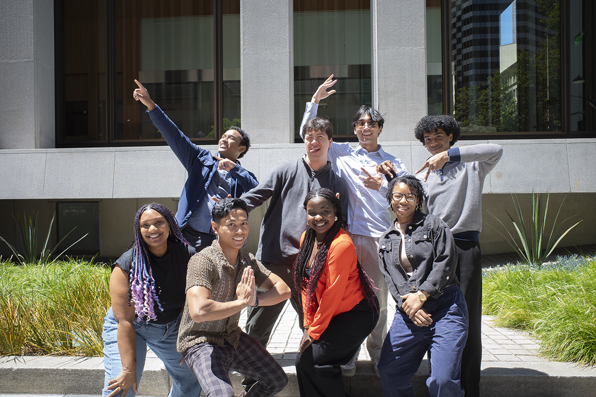 Cohorts posing in front of building