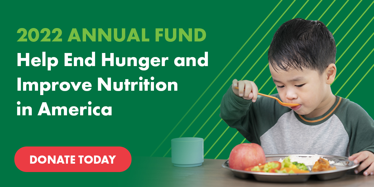 Young boy eating a healthy meal over a green background. Text on the left-hand side reads: 2022 Annual Fund - Help End Hunger and Improve Nutrition in America - DONATE TODAY