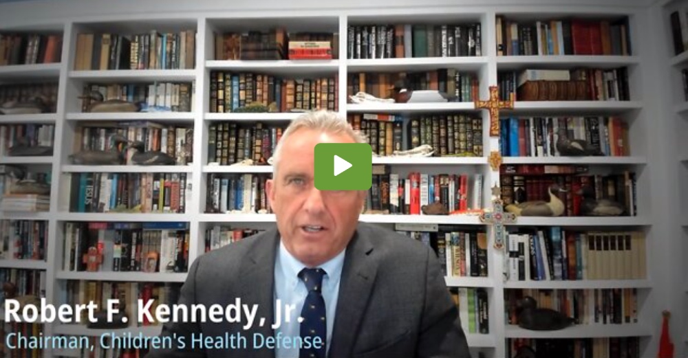Robert F. Kennedy, Jr. seen in front of a large bookcase filled with books, with a play button overlaid