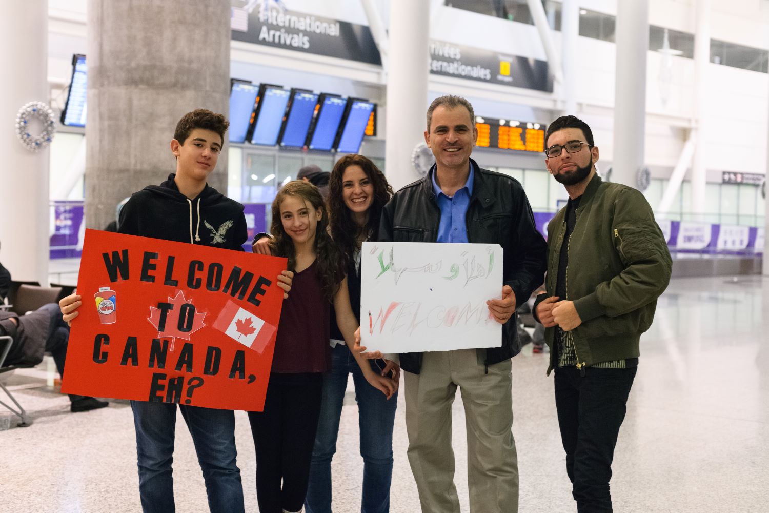 Canadians welcome Syrian refugees to Toronto.