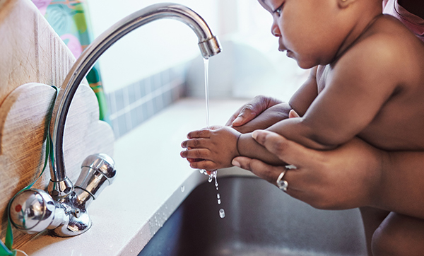 Photo of mom and baby washing hands.