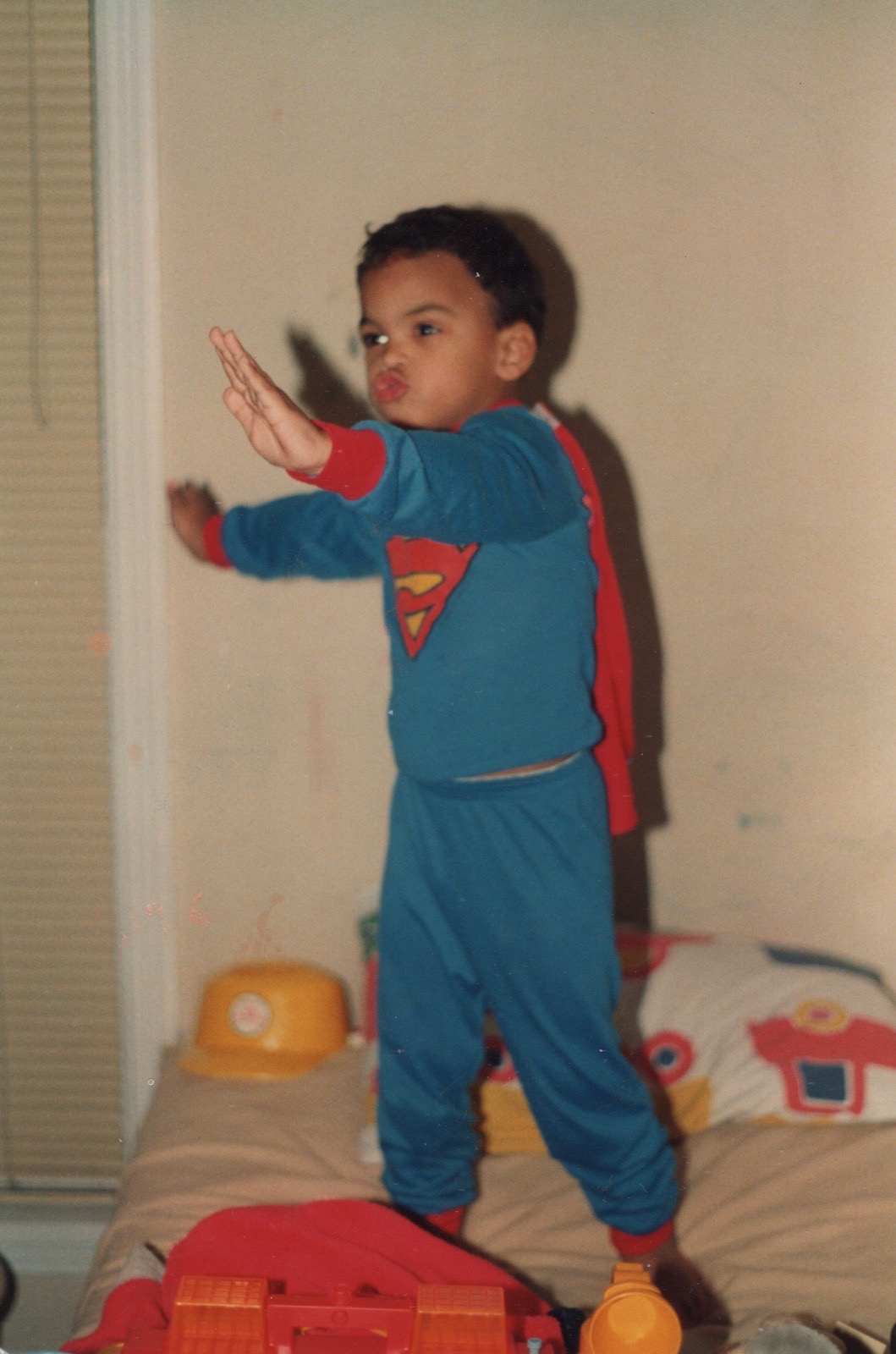 Young Colin Allred in Superman pajamas