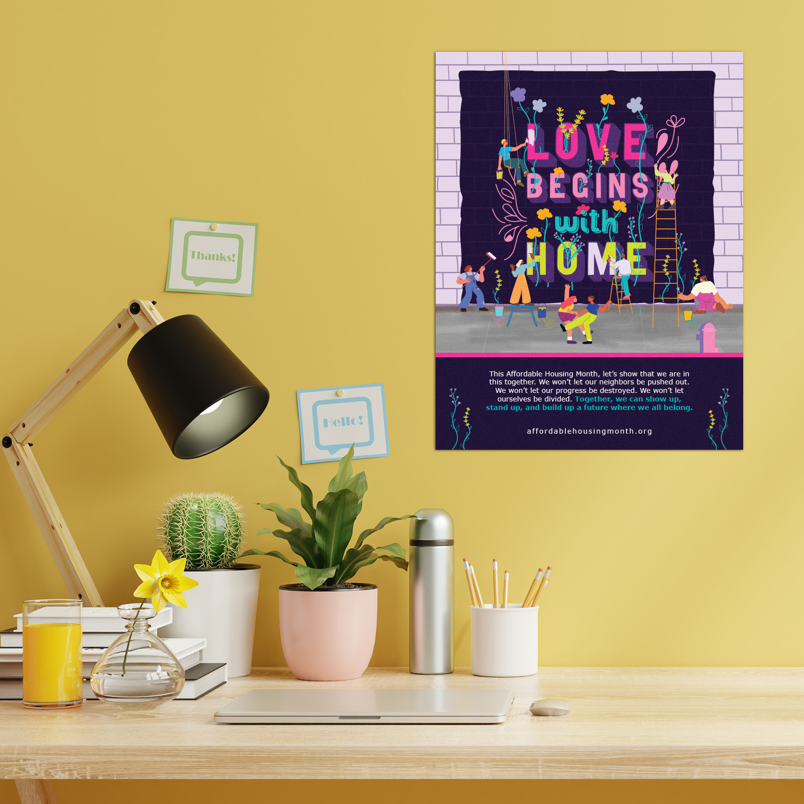 Poster on yellow wall behind a desk
