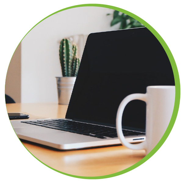 Computer and coffee mug