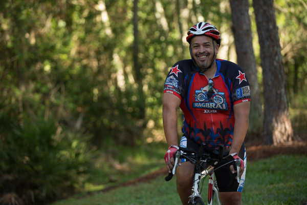 man riding bike outside in park