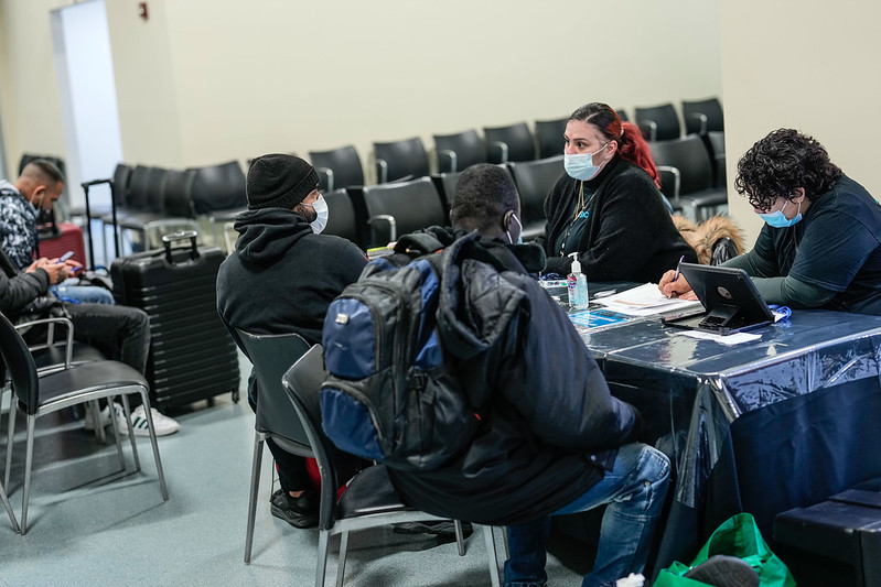 Asylum seekers receive assistance at the Brooklyn Cruise Terminal in New York City.