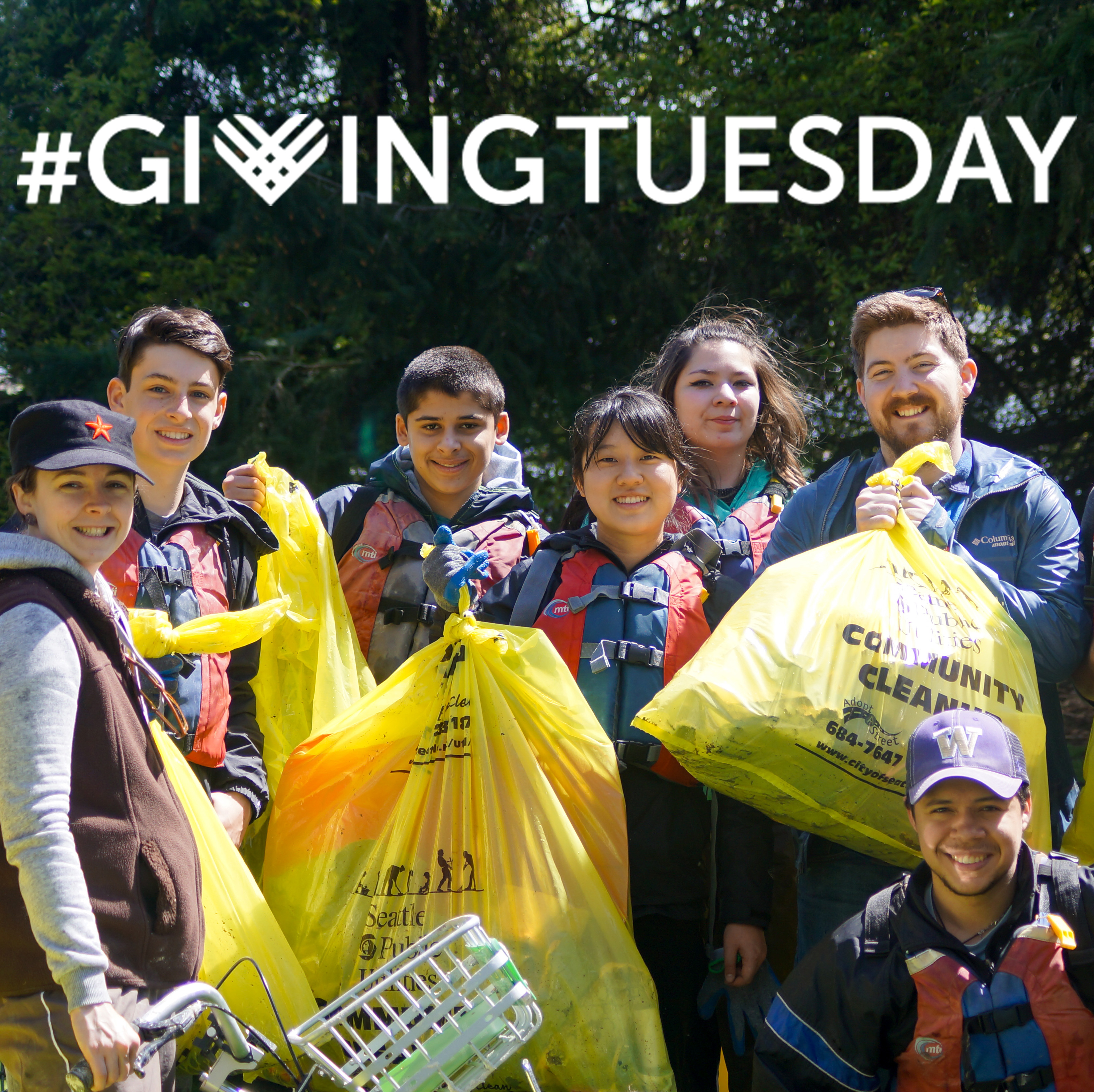 The Giving Tuesday logo appears over an image of volunteers at a cleanup holding trash bags and smiling at the camera.