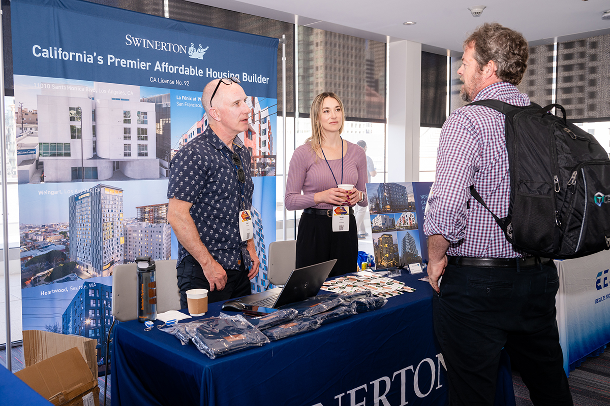 Past NPH sponsors speaking with Conference attendees