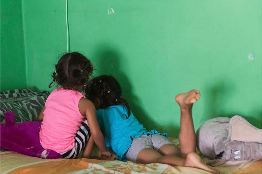 A family in a shelter in Juarez, Mexico, waiting to apply for asylum because of the Remain in Mexico program. Photo credit: Jordyn Rozensky