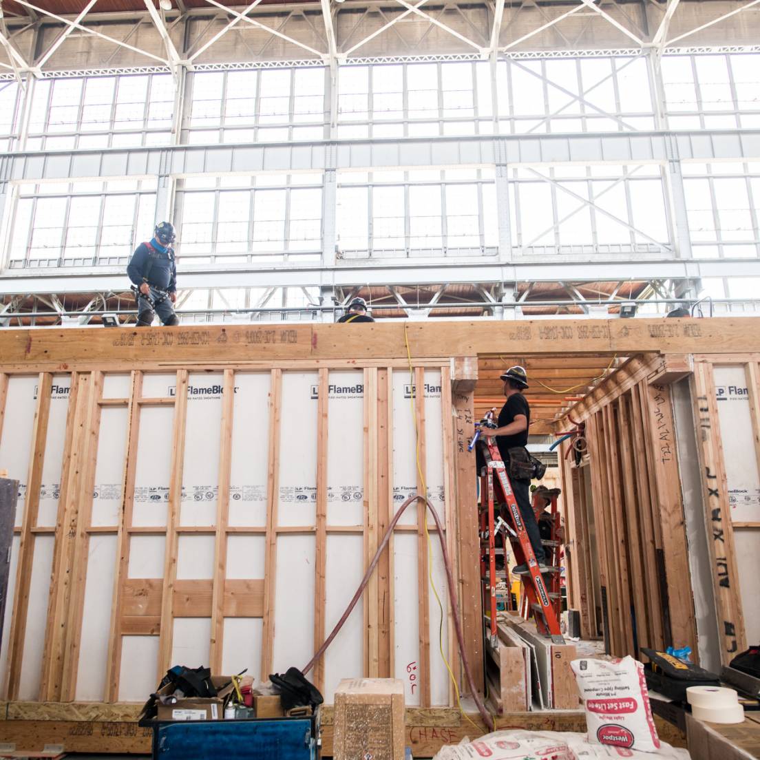 People building housing structure