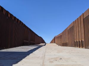 A double border wall leads to a boat launch in Yuma, Arizona