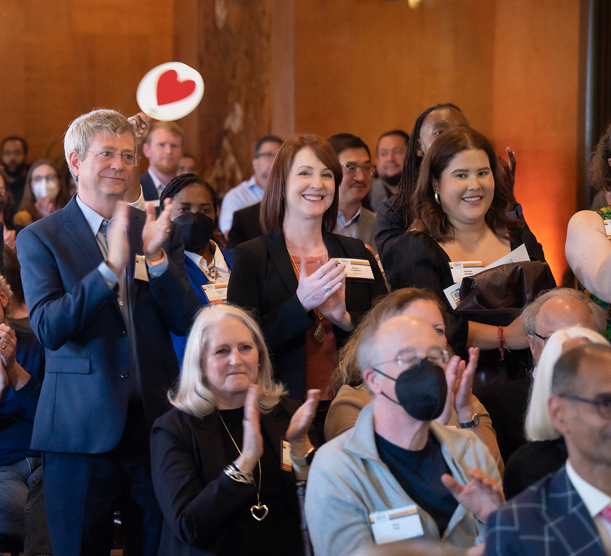 Group clapping at past NPH Awards