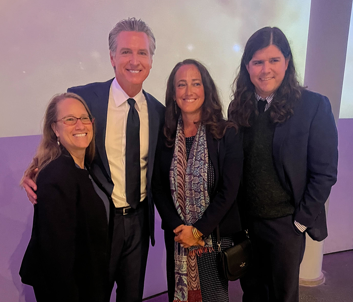 Gavin Newsom in a group photo with Amie Fishman and J.T. Harechmak
