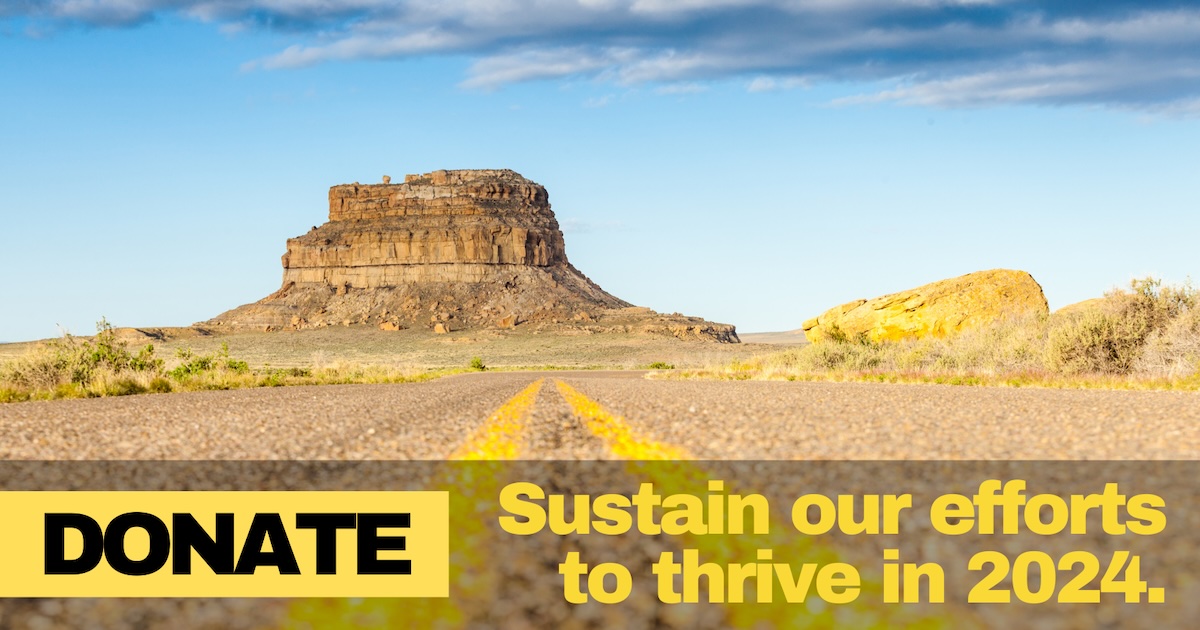 A photo of a desert mesa in daytime sunshine. Text over the image says Donate to sustain our efforts to thrive in 2024.