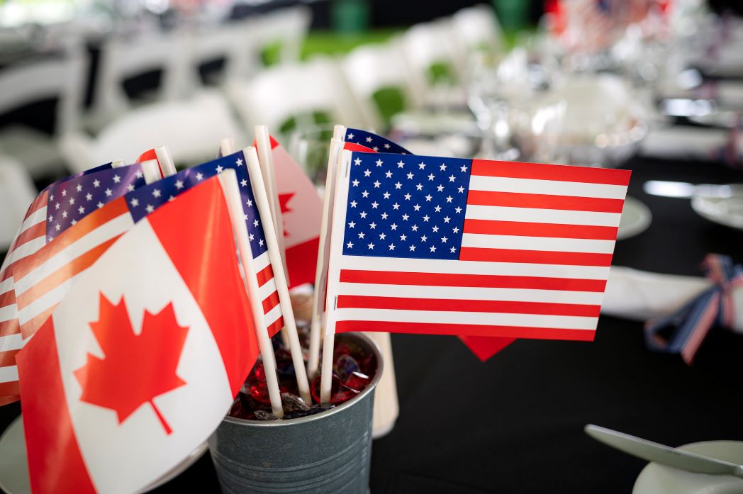 Flags of the United States and Canada.