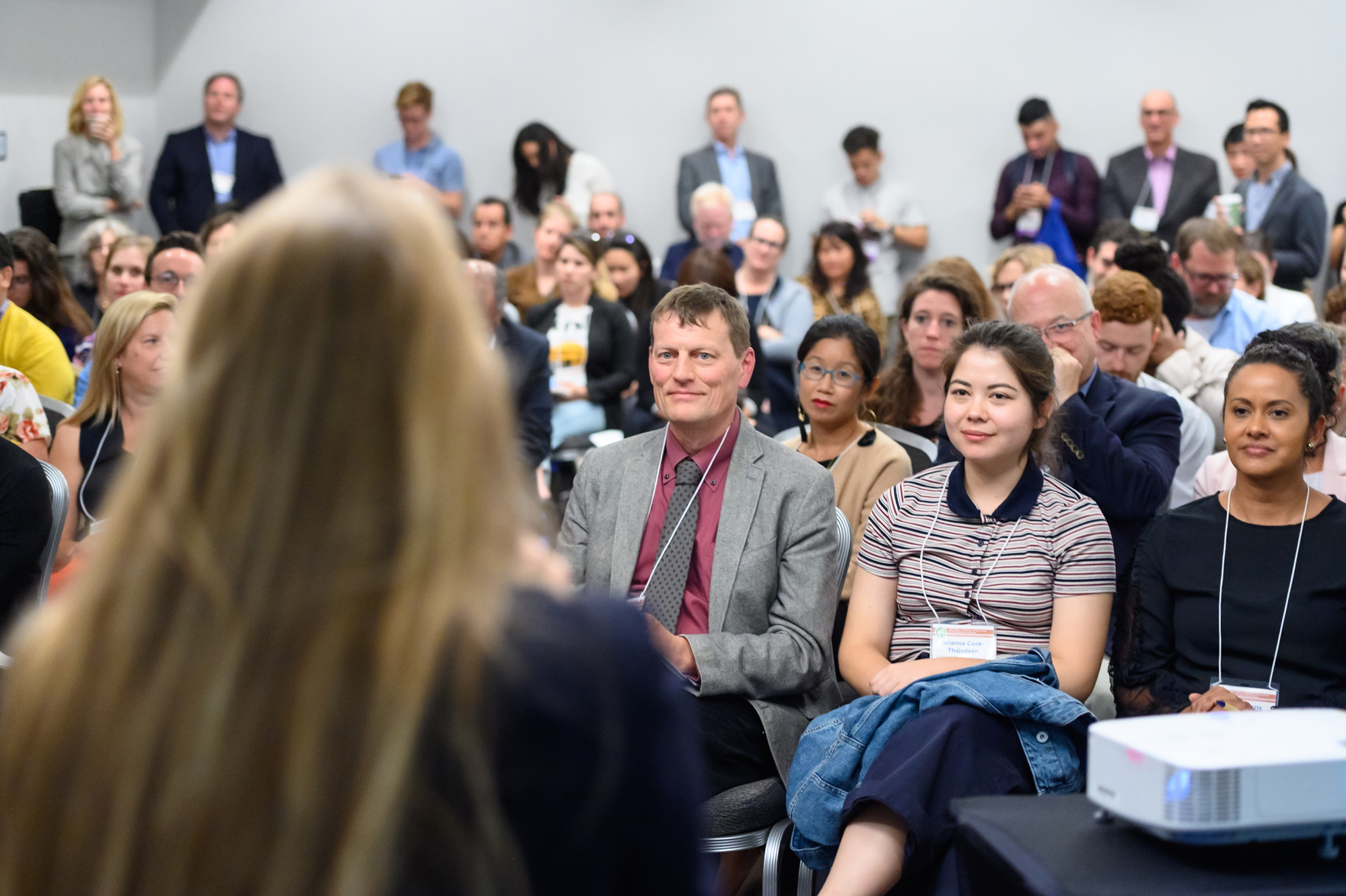 Conference presenter facing the crowd