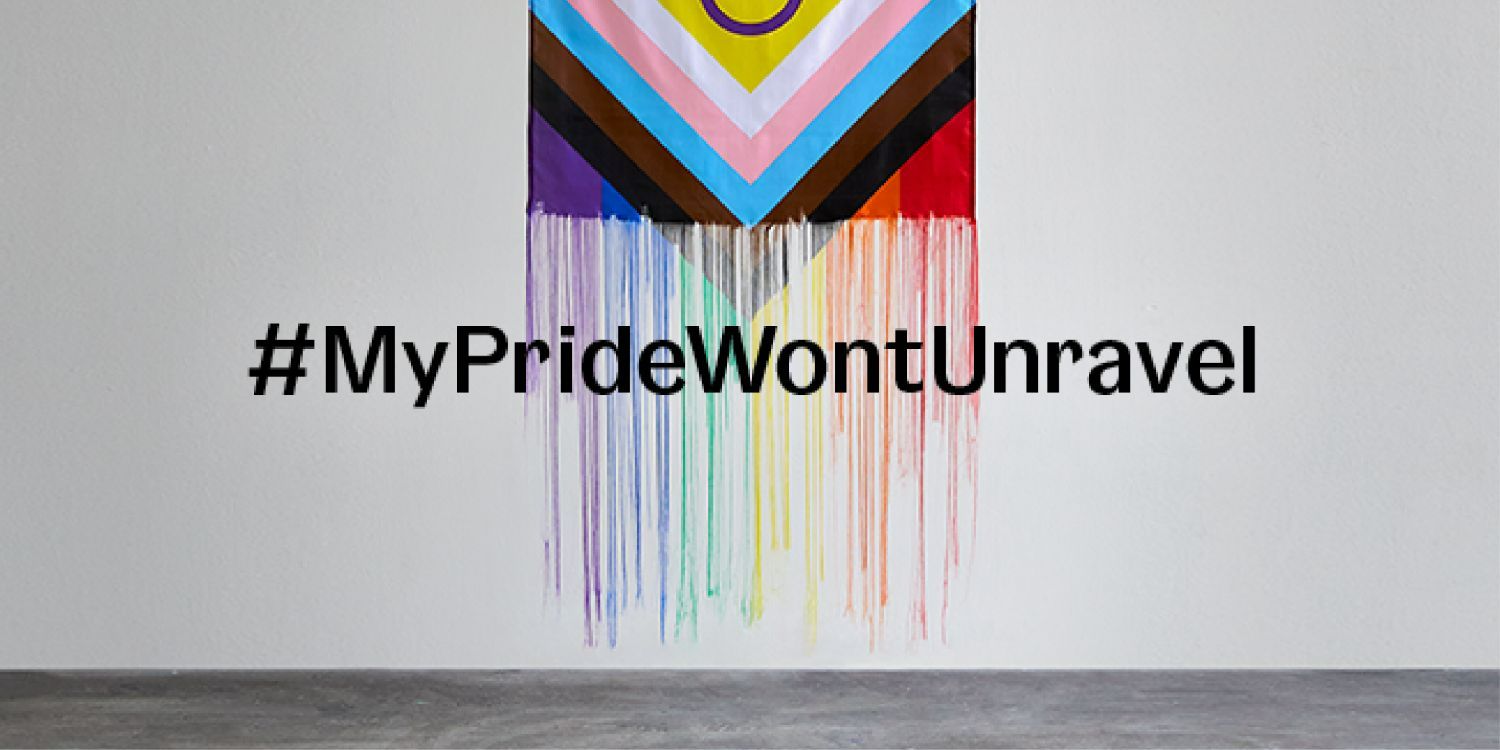 The Intersex Progress Pride flag on a grey background with overlaid text that says '#MyPrideWontUnravel'.