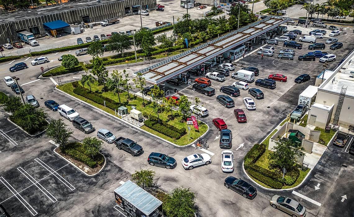 Cars lined up down the street for gas in Florida.