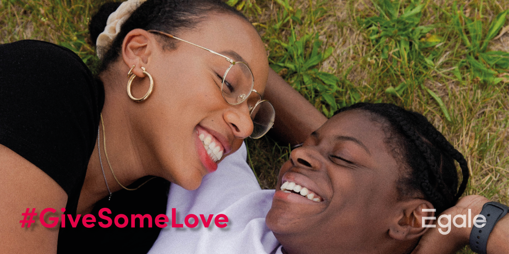 2SLGBTQI couple laying in the grass #GiveSomeLove