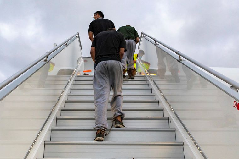 Migrants being deported from the United States to Mexico.