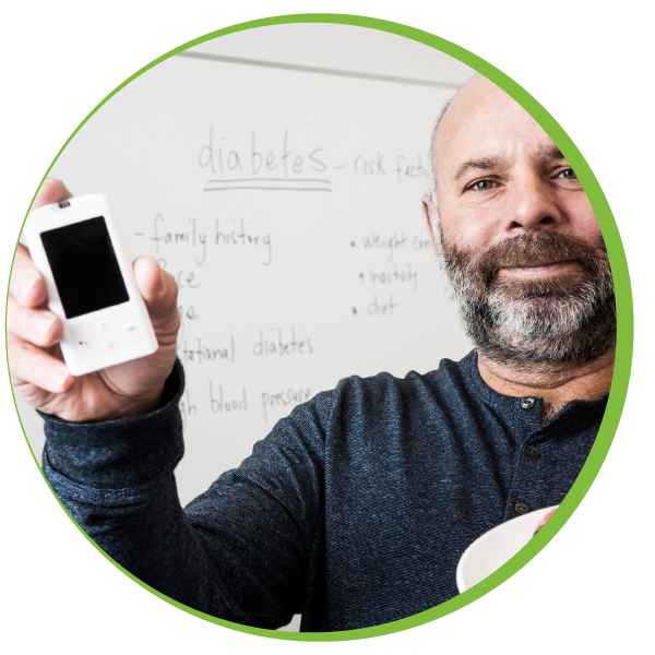 Man holding blood sugar monitor