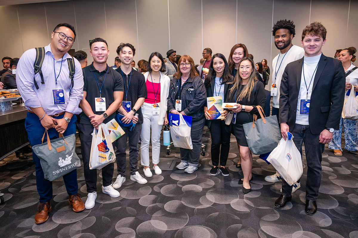 Group of Conference attendees smiling towards the camera