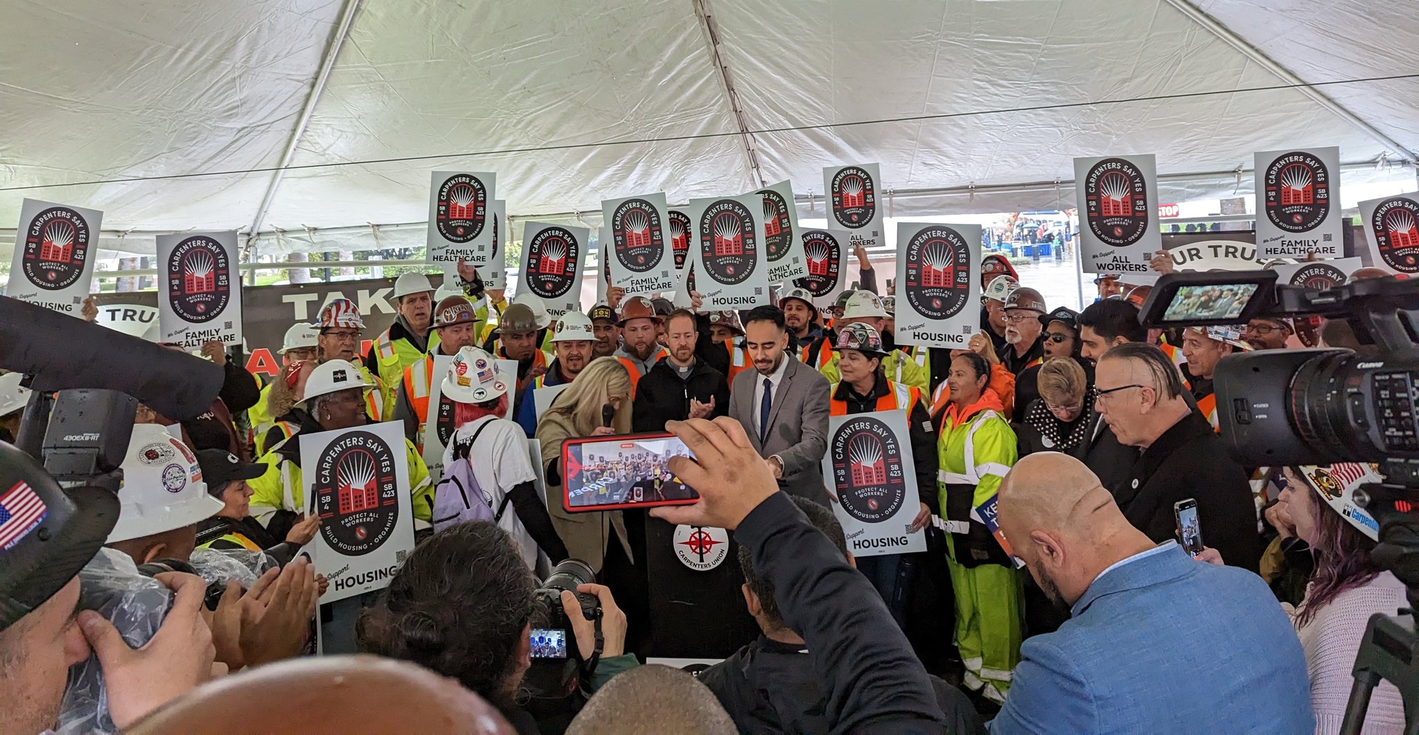 Abram speaking at a rally