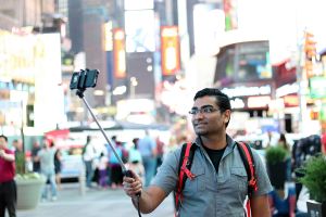 A tourist takes a selfie in New York City